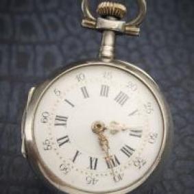 SIlver lady pocket watch with unusual time setting mechanism 